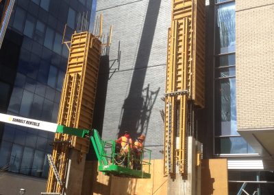 construction lift in front of a commercial building